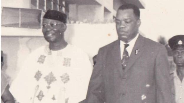 Sir Louis Odumegwu Ojukwu to the right